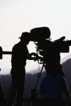 Silhouette of Man and Film Camera
